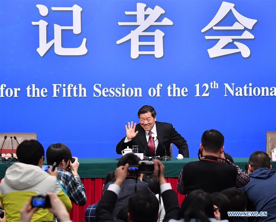 Director of the National Development and Reform Commission (NDRC) He Lifeng greets journalists during a press conference on China's economic and social development and macro-economic control for the fifth session of the 12th National People's Congress in Beijing, capital of China, March 6, 2017. Photo: Xinhua