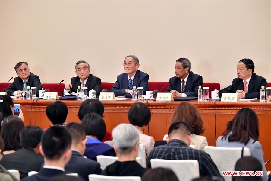 Li Yining, Chen Xiwen, Yang Kaisheng, Chang Zhenming and Qian Yingyi, members of the 12th National Committee of the Chinese People's Political Consultative Conference (CPPCC), attend a press conference for the fifth session of the 12th CPPCC National Committee on promoting stable and healthy economic growth at the Great Hall of the People in Beijing, capital of China, March 6, 2017. (Xinhua/Li Xin)