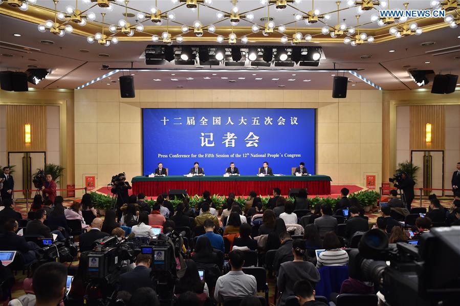 Zhang Rongshun and Xu Anbiao, vice-chairmen of the Legislative Affairs Commission of the National People's Congress (NPC) Standing Committee, and Wang Aili, director-general of the Office of Criminal Laws of the Legislative Affairs Commission of NPC Standing Committee, take questions on the draft general provisions of civil law and legislation of the NPC at a press conference for the fifth session of the 12th NPC in Beijing, capital of China, March 9, 2017. Photo: Xinhua