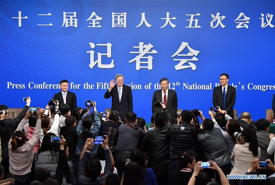 Zhou Xiaochuan, governor of the People's Bank of China (PBC), Yi Gang, deputy governor of the PBC, Pan Gongsheng, deputy governor of the PBC and director of the State Administration of Foreign Exchange, and Fan Yifei, deputy governor of the PBC, greet the journalists at a press conference on financial reform and development for the fifth session of the 12th NPC in Beijing, capital of China, March 10, 2017. Photo: Xinhua