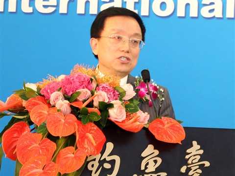 President Guan Jianzhong answers reporters’ questions at the press conference