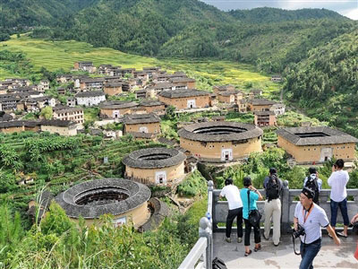Tourists visit Tulous in Yongding, China's Fujian