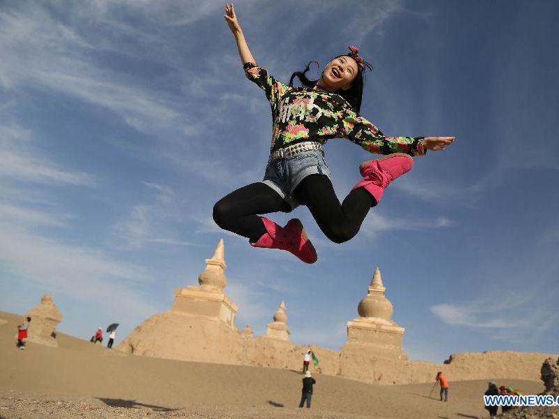 Tourists in Heicheng, ancient city on Silk Road