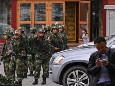 Chinese state media says 5 suicide bombers carried out Xinjiang attack