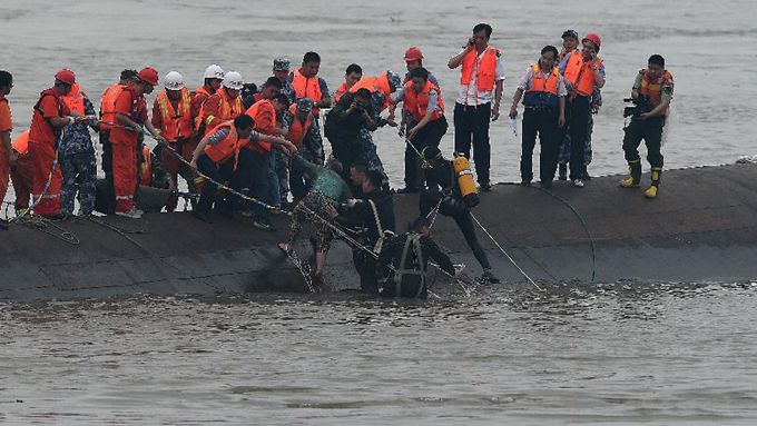 At least 14 rescued from capsized ship