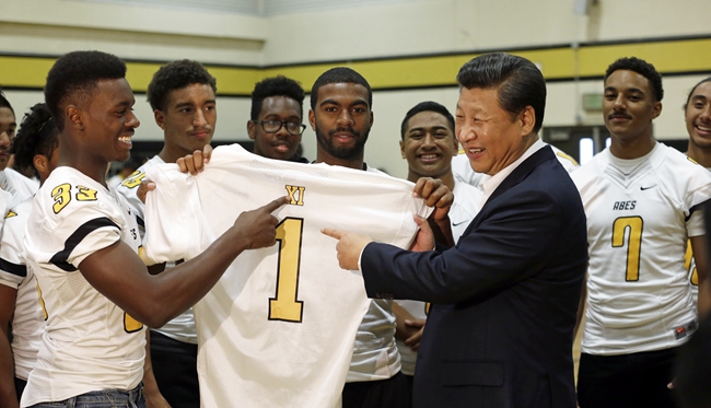 Xi gets football jersey at Lincoln High School
