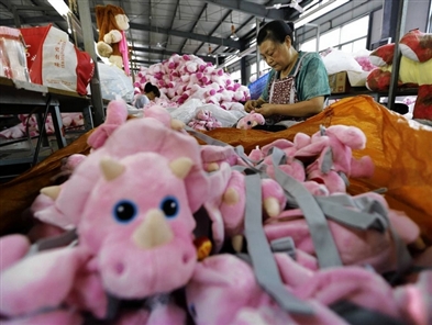 China lowers 2014 GDP growth to 7.3 percent from 7.4 percent