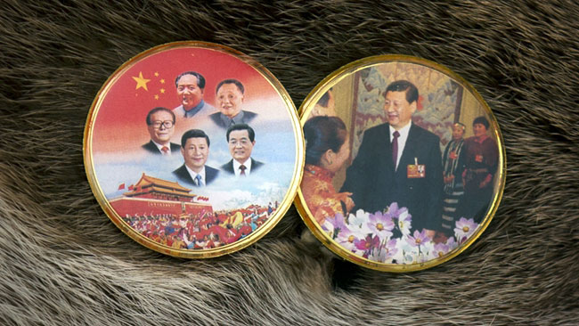 Tibetan delegates wear loyalty pins